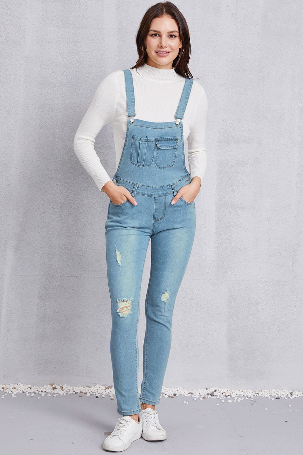 Distressed Washed Denim Overalls with Pockets.