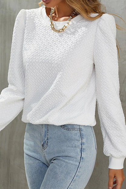 Chic white textured puff sleeve top with round neckline