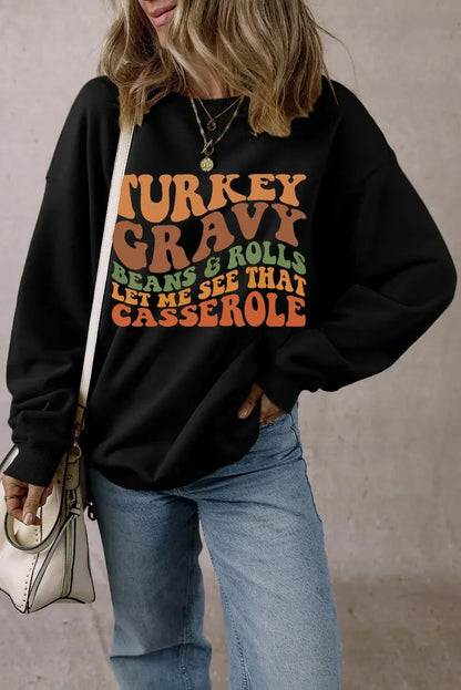 Letter Graphic Round Neck Long Sleeve Sweatshirt with Turkey Gravy print, worn with jeans and a handbag.