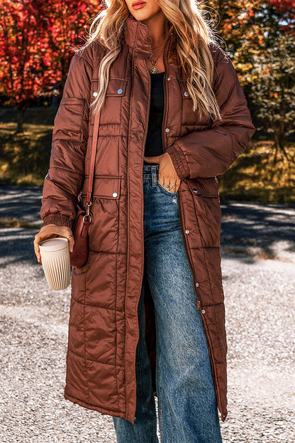 Cozy coffee quilted puffer coat with stand neck and easy zip closure, perfect for winter layering.