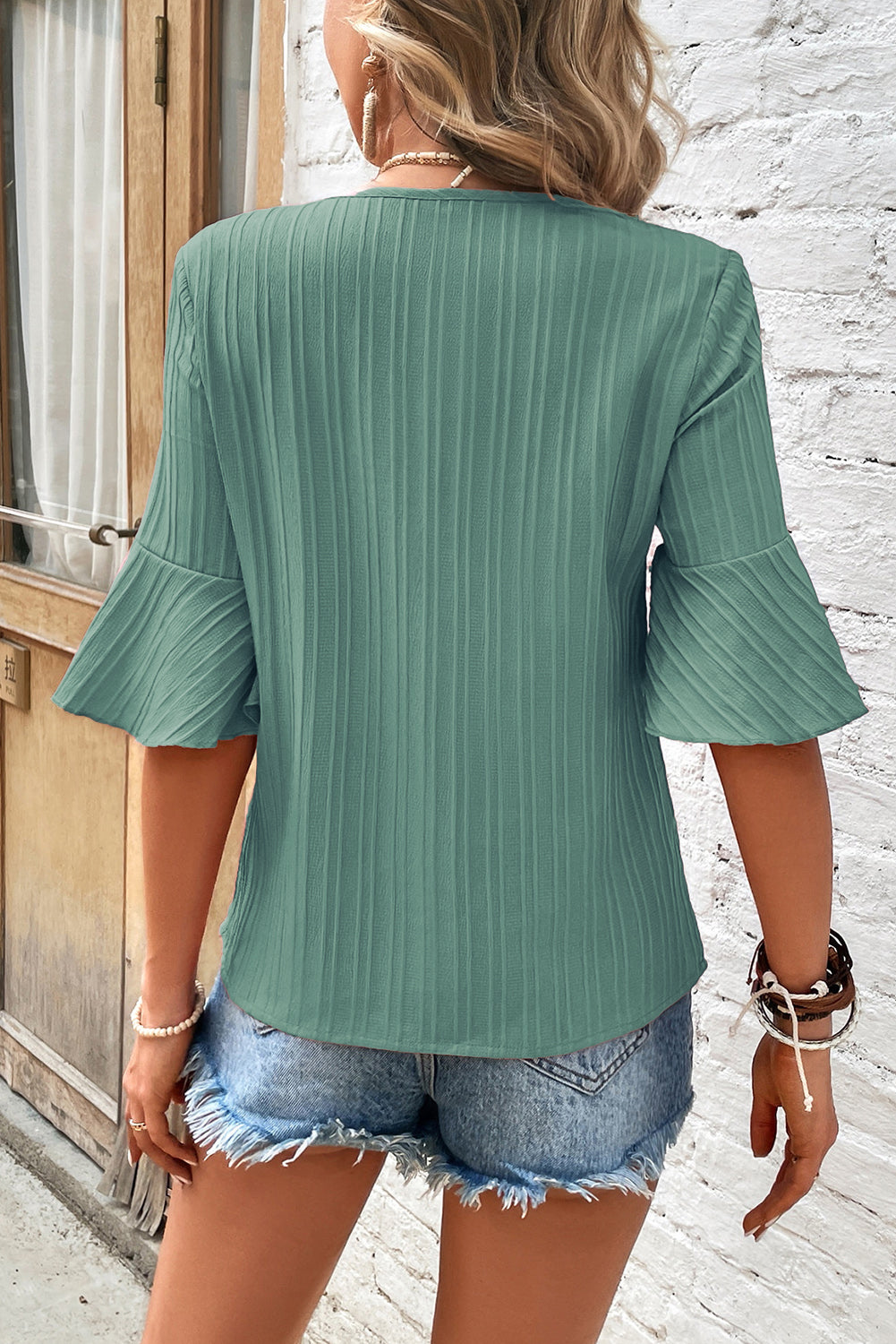 Chic grass green ruffled top with half sleeves and v-neck detail