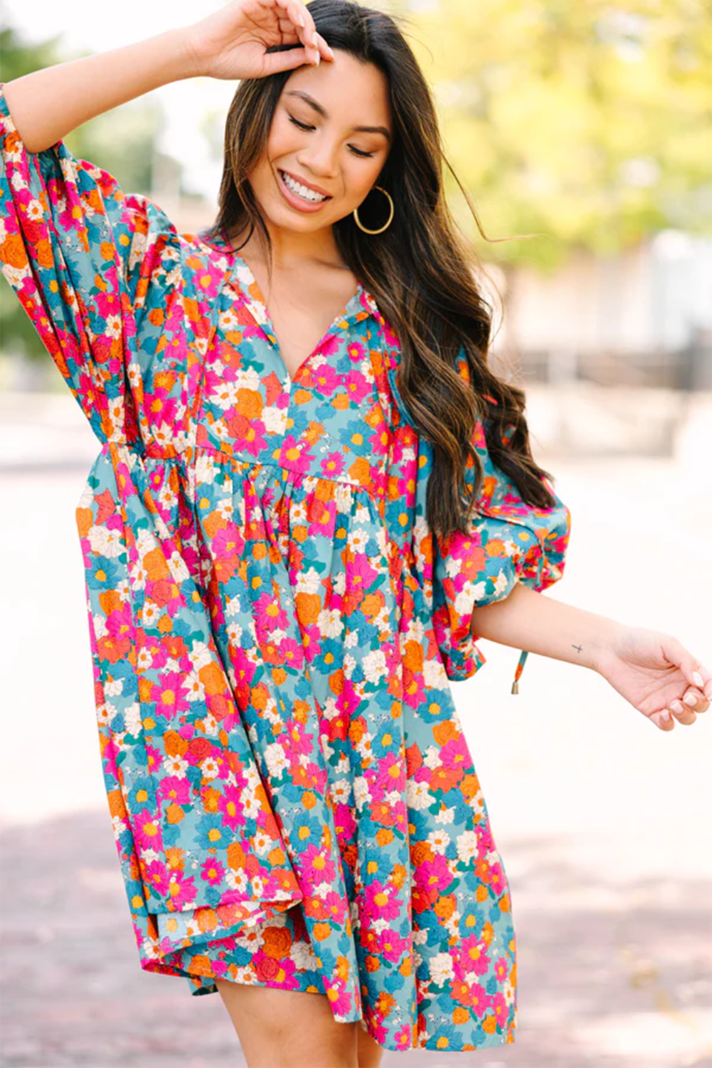 Charming sky blue floral babydoll dress with bubble sleeves and tie neckline