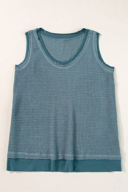 Teal flowy vest with scoop neckline and waffle knit texture