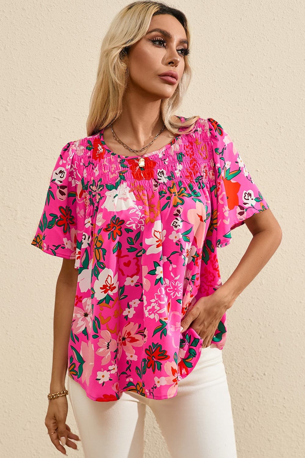 Smocked Printed Round Neck Half Sleeve Blouse.