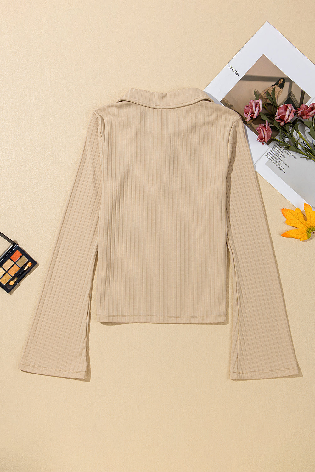 Chic beige ribbed long sleeve top with buttoned collar