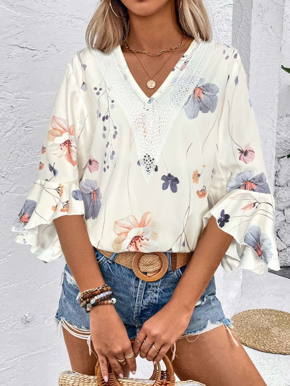 Ruffled Printed V-Neck Half Sleeve Blouse.