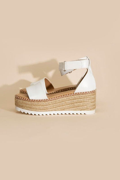 TUCKIN-S PLATFORM SANDALS.