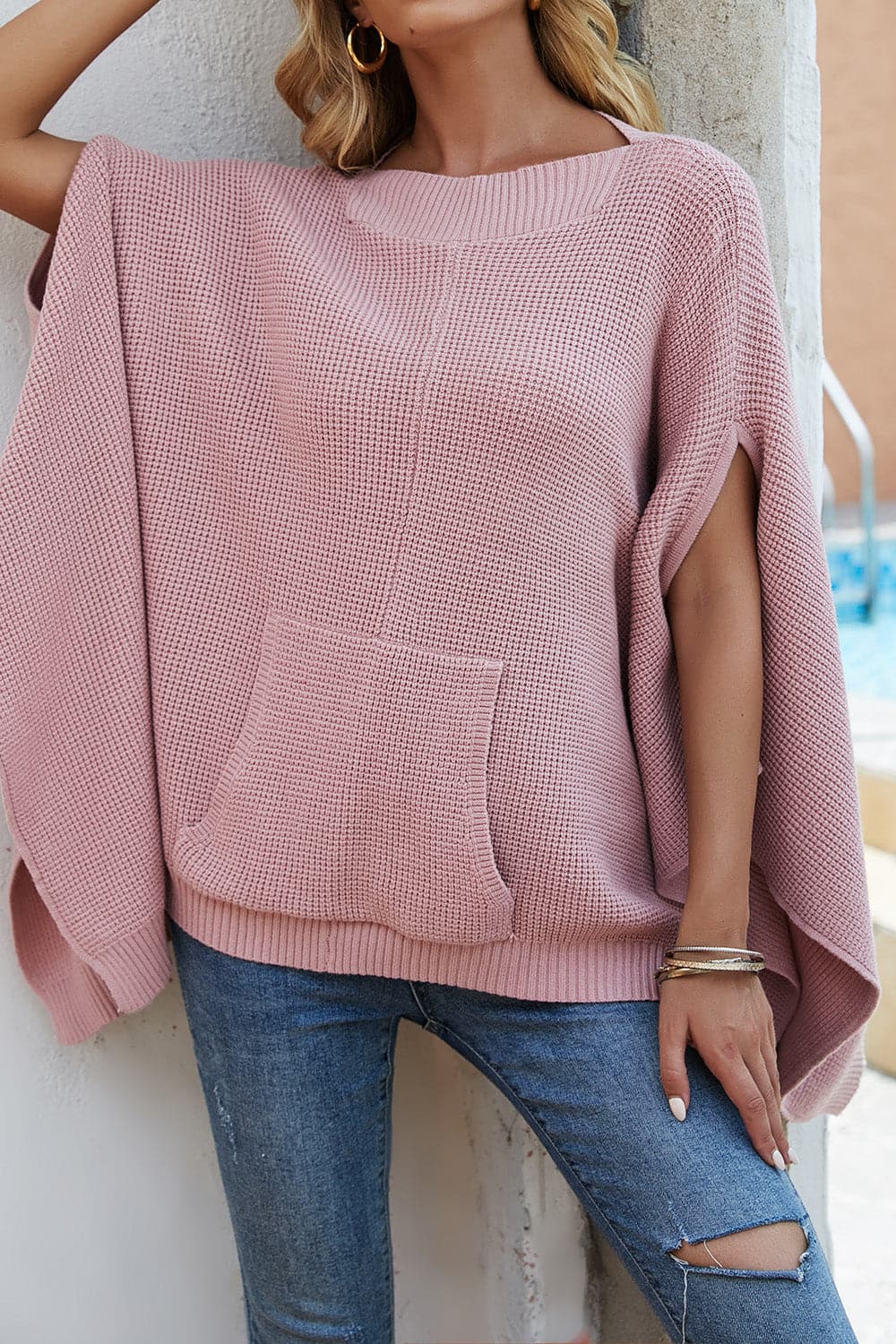 Waffle-Knit Pocketed Cape Sleeve Sweater.