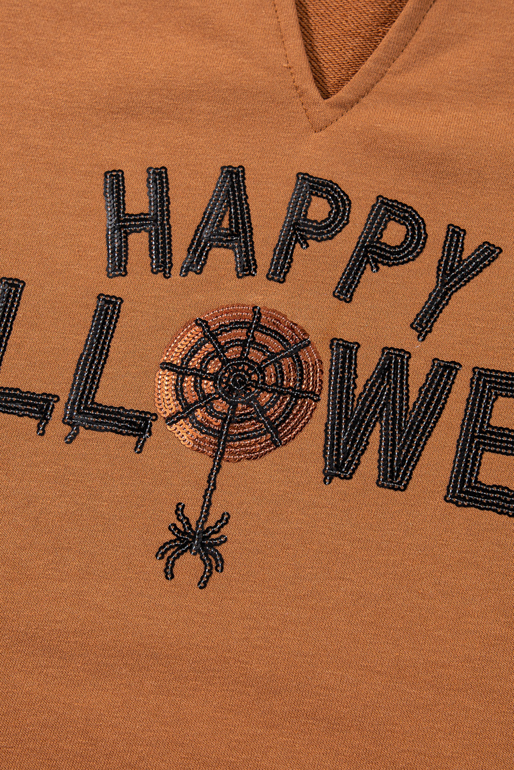 Chic chestnut Halloween top with sequin graphic and long sleeves