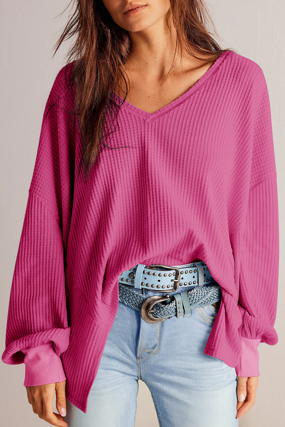 Chic bright pink waffle knit V-neck blouse with drop shoulders