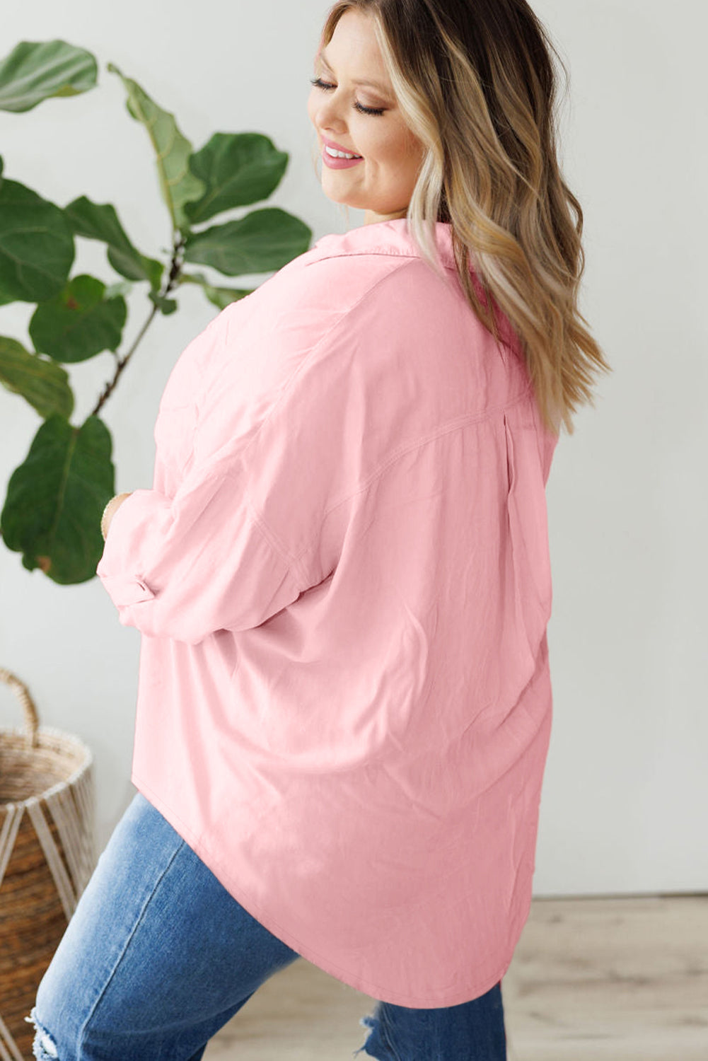 Chic pink plus size button-down shirt with flap pockets and roll-tab sleeves