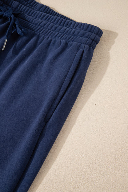 Navy blue fleece joggers with drawstring