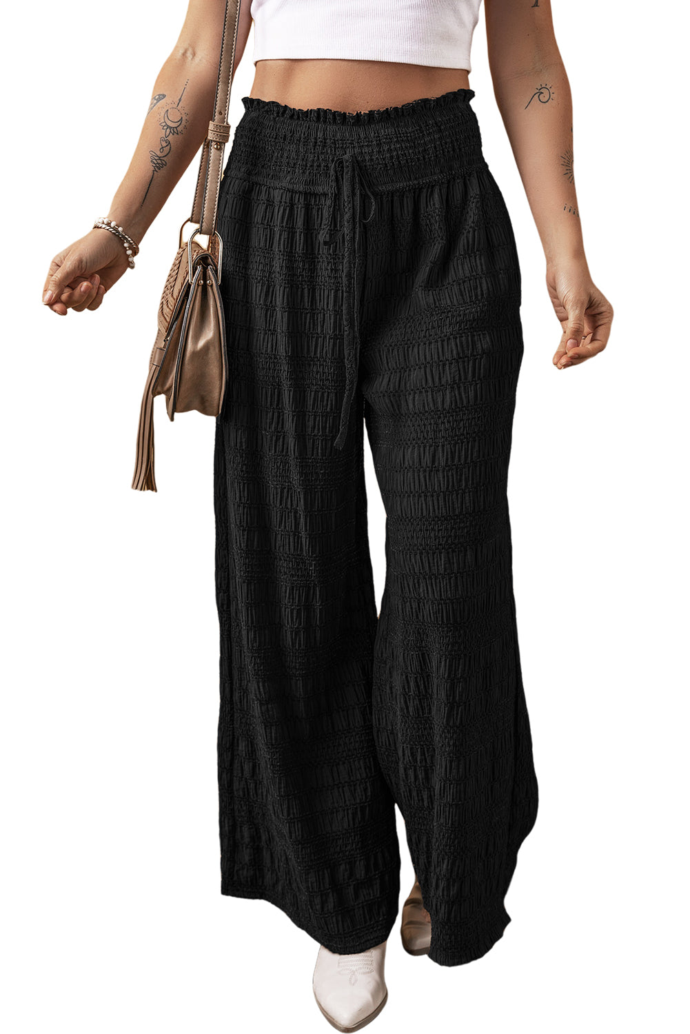 Relaxed black textured smocked waist wide-leg pants