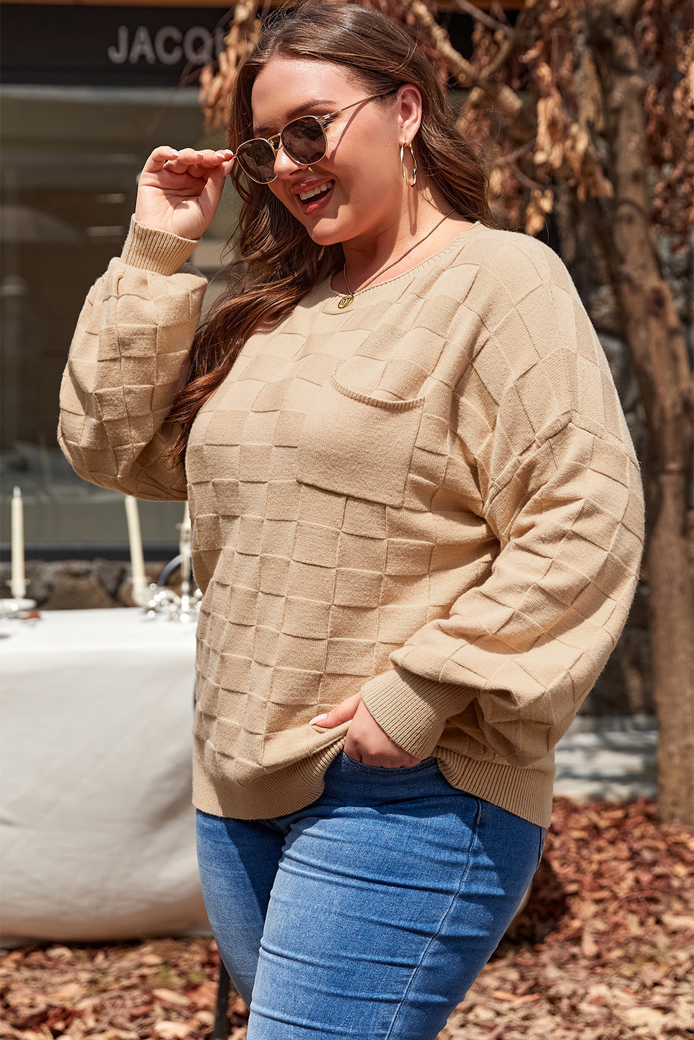 Cozy elegance: Light beige checkered textured knit sweater in plus sizes