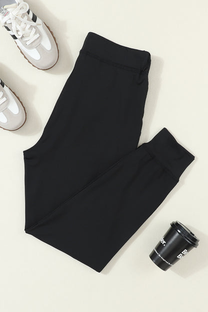 Cozy black joggers with drawstring and pockets