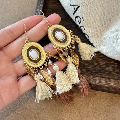 Feather and rice bead alloy earrings