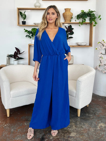 Double Take Full Size Surplice Wide Leg Jumpsuit with Pockets.