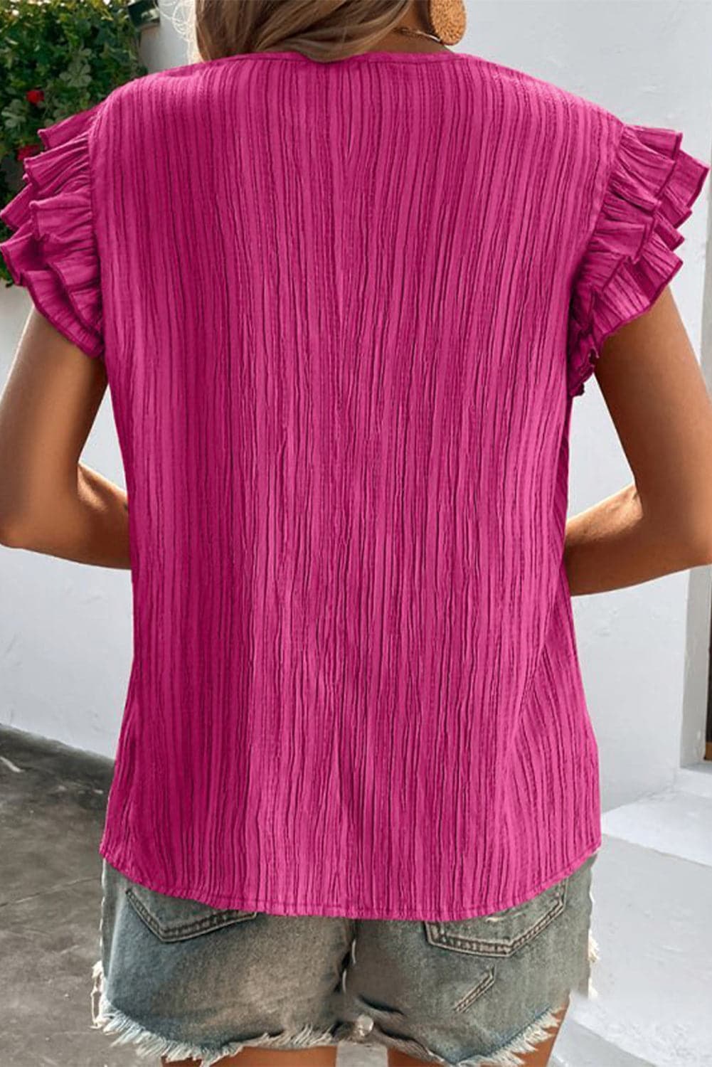 Ruffled Tie Neck Cap Sleeve Blouse.