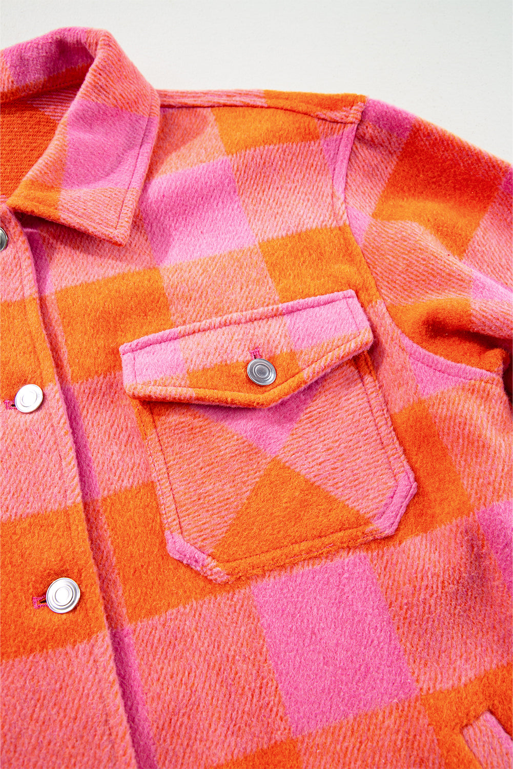 Orange plaid button-up jacket with chest pockets and turn-down collar