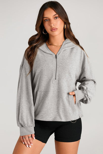 Sheer pocketed half zip hoodie for a stylish look