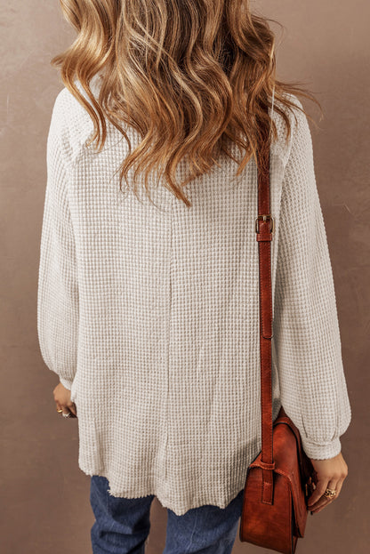 Cozy oatmeal waffle knit blouse with buttoned front and raglan sleeves