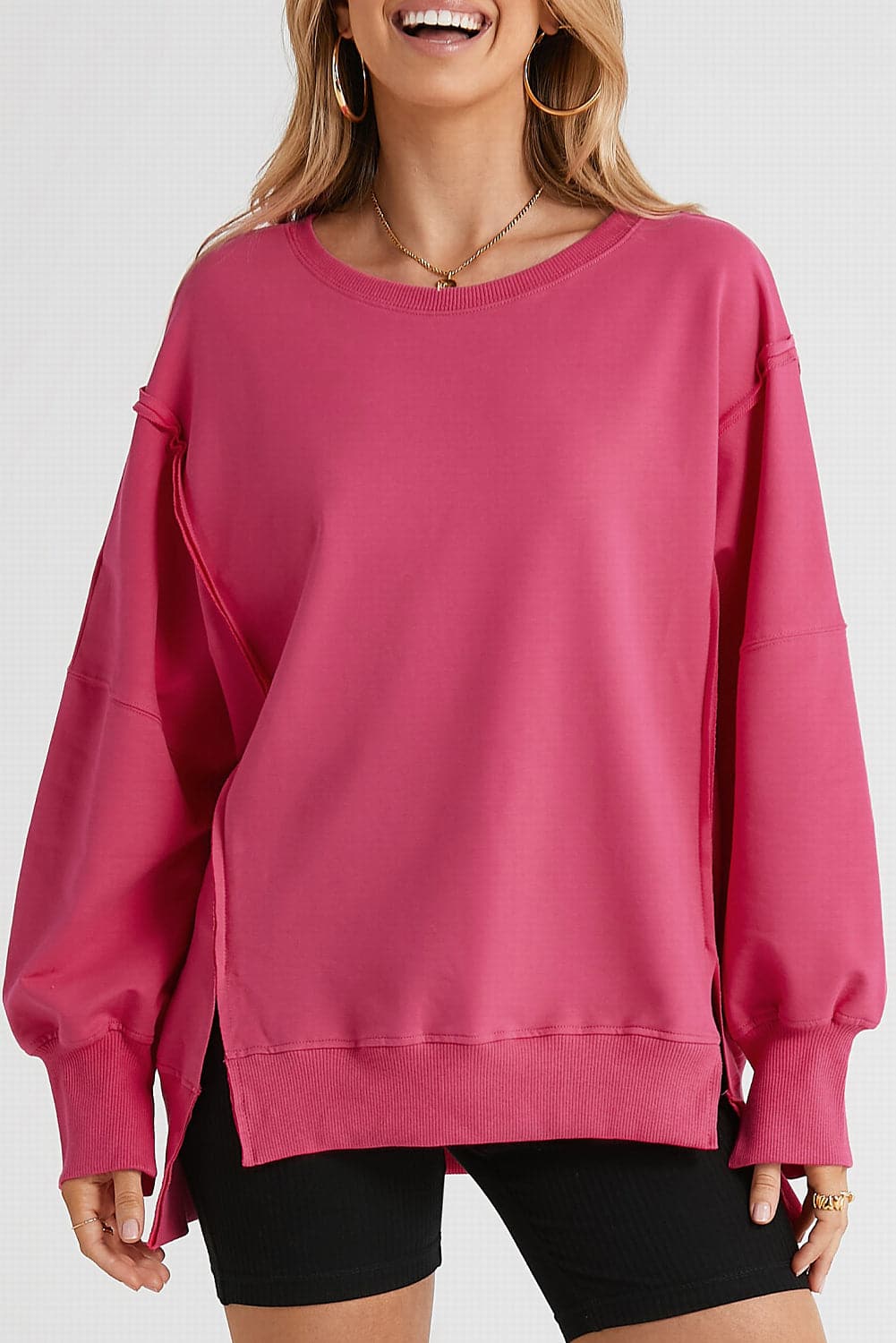 Slit Exposed Seam Round Neck Sweatshirt.