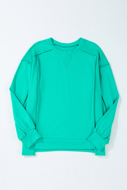 Mint green spliced pullover sweatshirt with round neckline