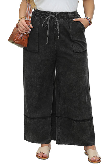 Chic black mineral wash wide leg cropped pants with exposed seams