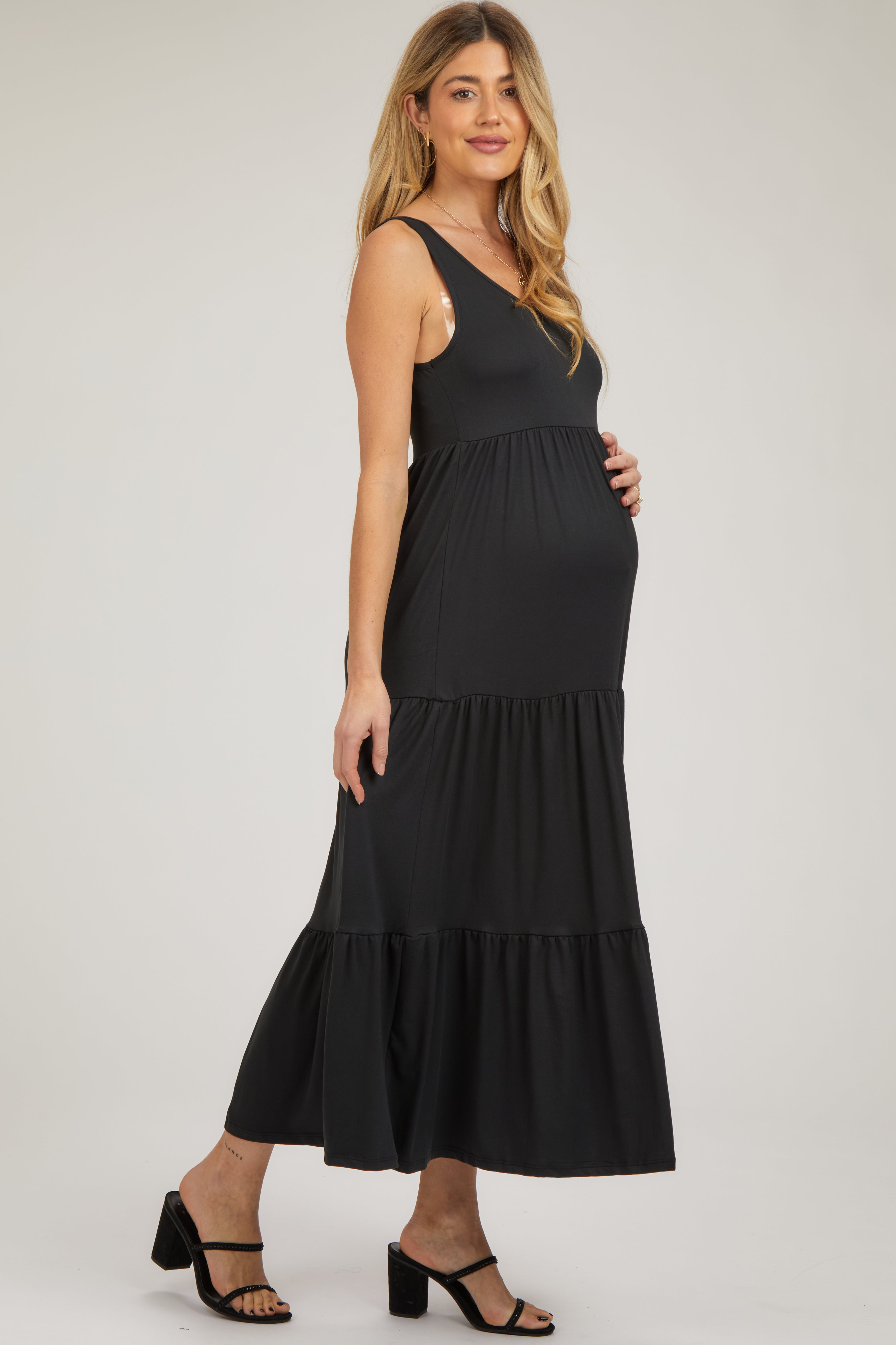 PinkBlush Black Sleeveless Tiered Maternity Maxi Dress, showing the stylish scoop back detail and flowy fabric.