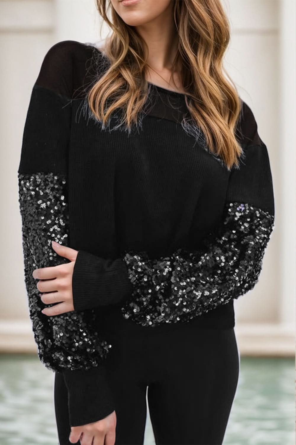 Glamorous sequined boat neck blouse with long sleeves