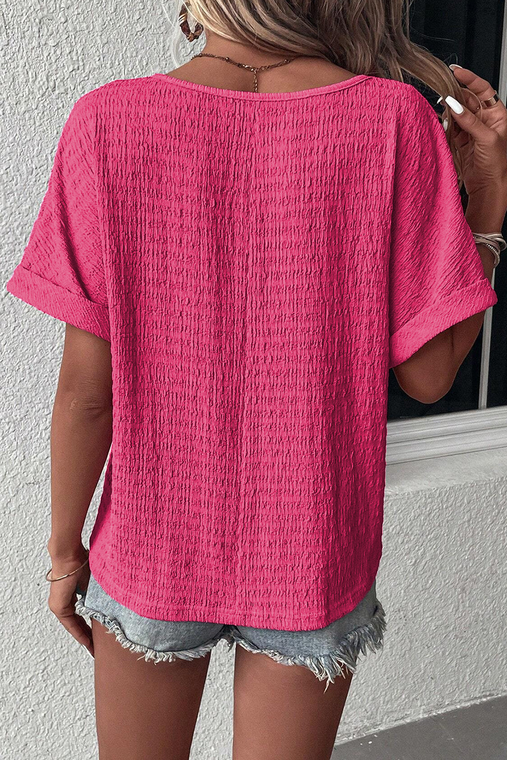 Chic bright pink rolled sleeve V neck tee for effortless style