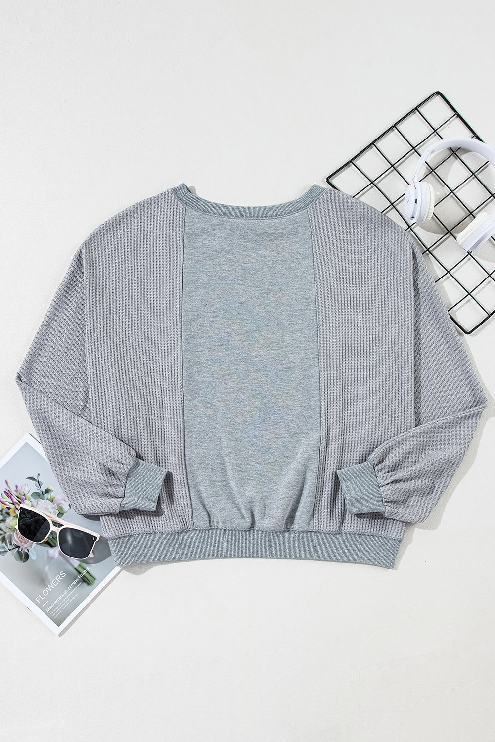 Chic light grey waffle patchwork pullover with raw hem details