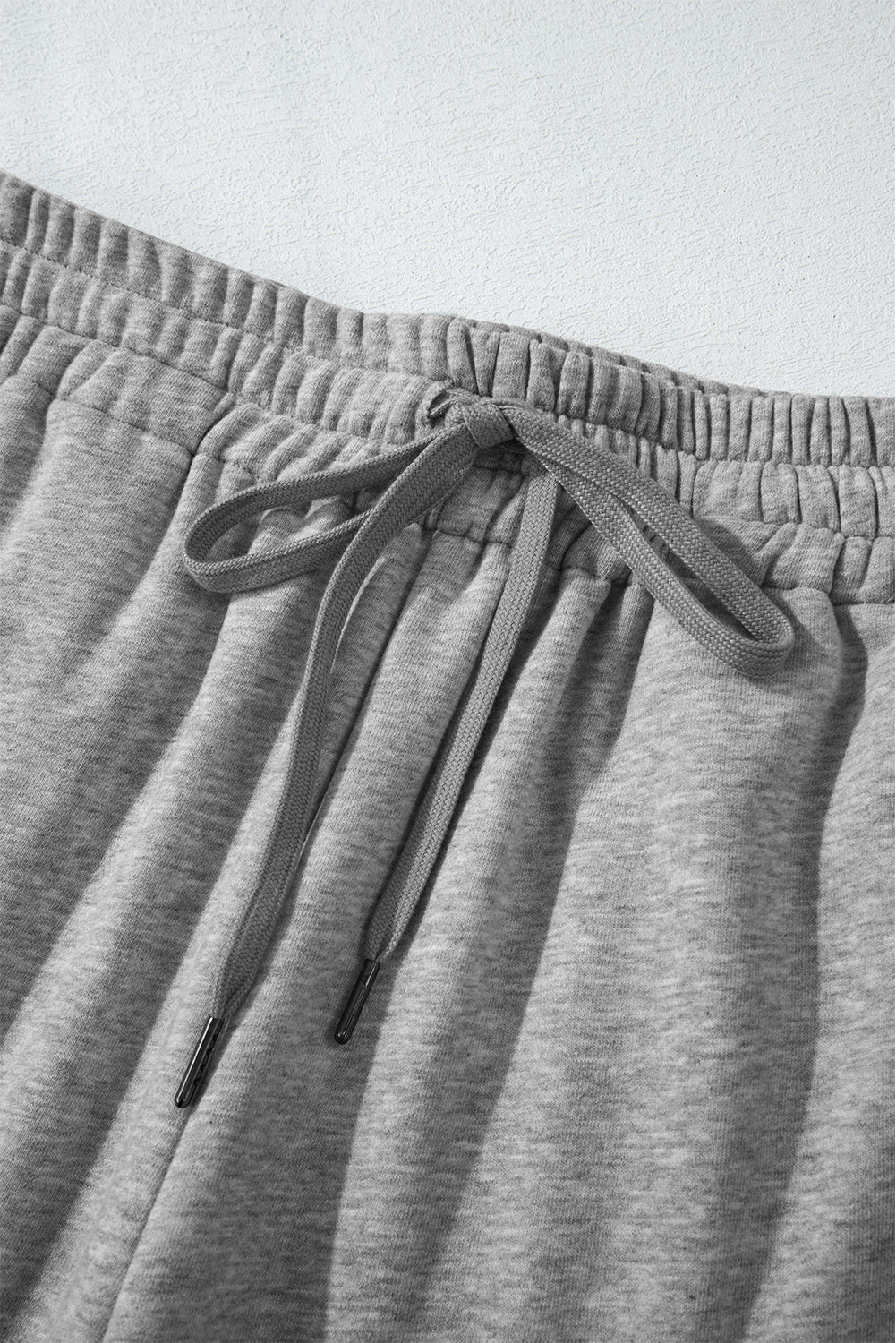 Light grey fleece pants with drawstring