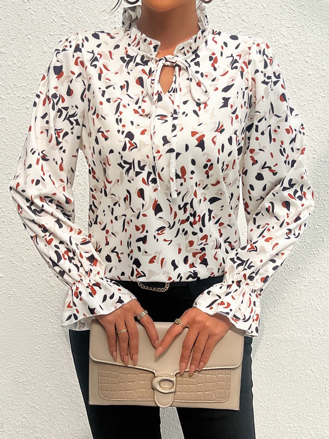 Ruffled Printed Tie Neck Long Sleeve Blouse.