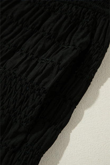 Relaxed black textured smocked waist wide-leg pants