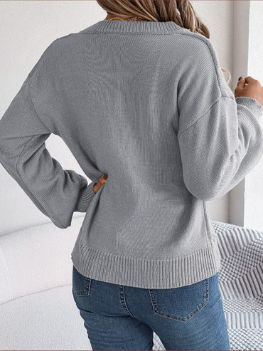 Cable-Knit Buttoned V-Neck Sweater.