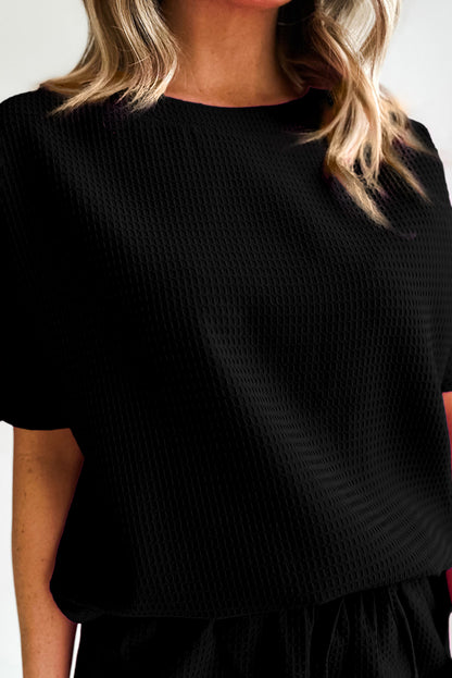 Chic black waffle knit tee and shorts ensemble