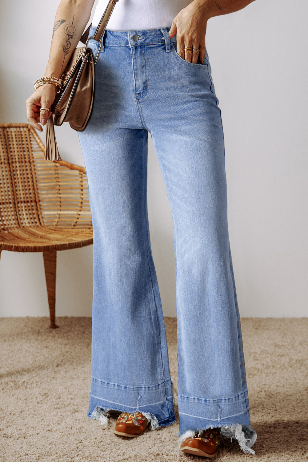 Ashleigh blue high-waisted flared jeans with raw hem detail