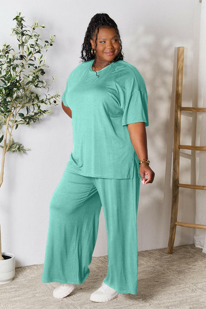 Double Take Full Size Round Neck Slit Top and Pants SetUpgrade Your Style with the Double Take Set
 Step into sophistication with our Double Take Full Size Round Neck Slit Top and Pants Set. This chic and versatile two-pLove Salve Full Size Round Neck Slit Topusa