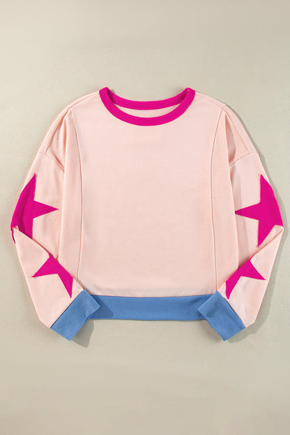 Chic light pink oversized sweatshirt with star patchwork design