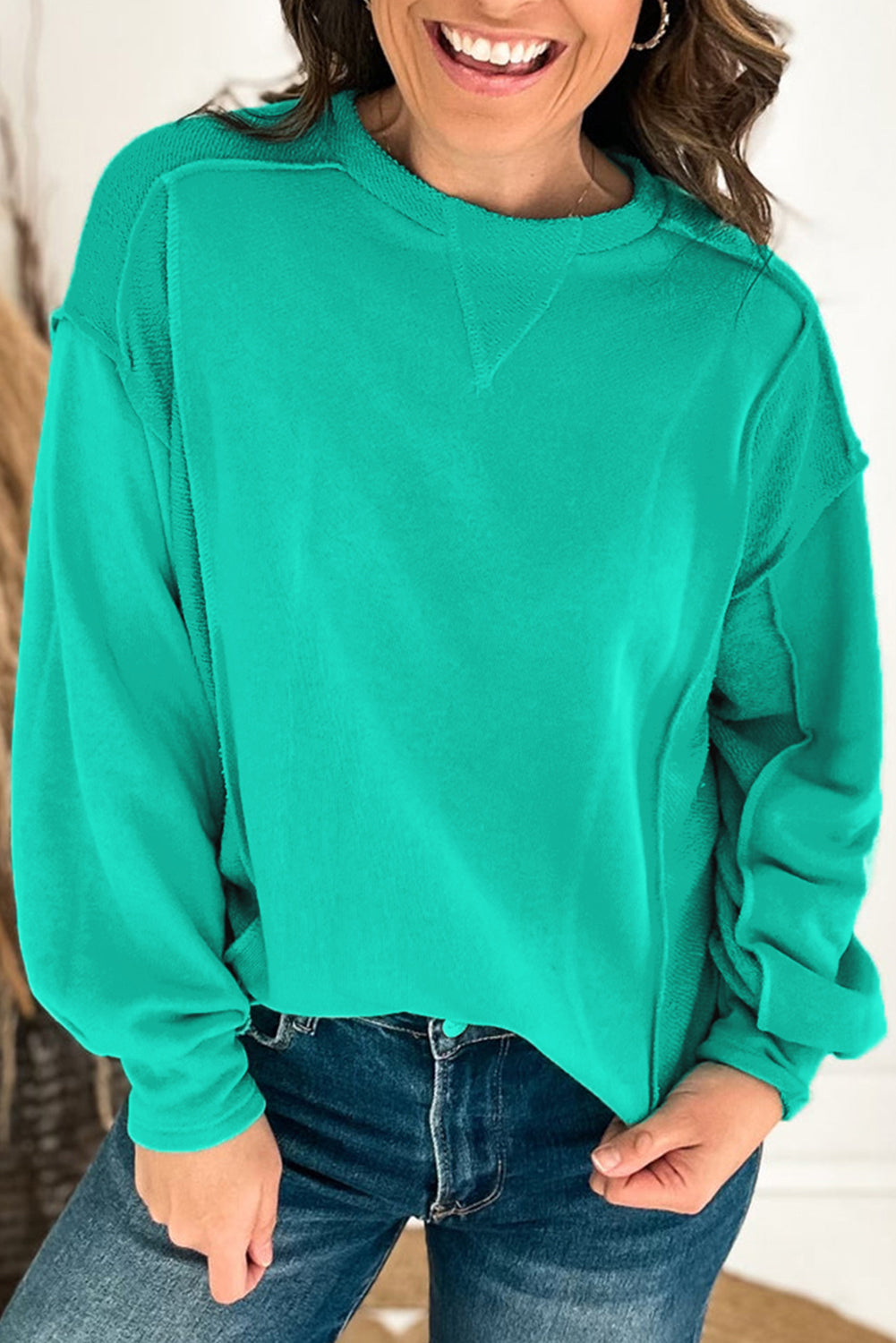 Mint green spliced pullover sweatshirt with round neckline