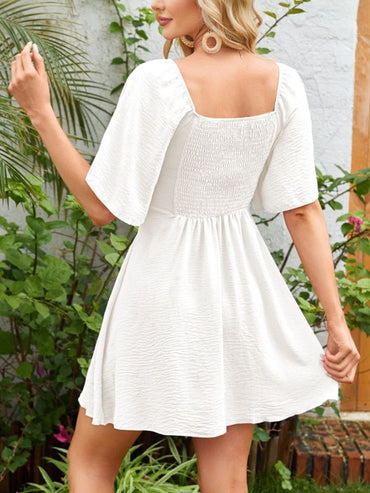 Breezy Charm Smocked Flutter Dress