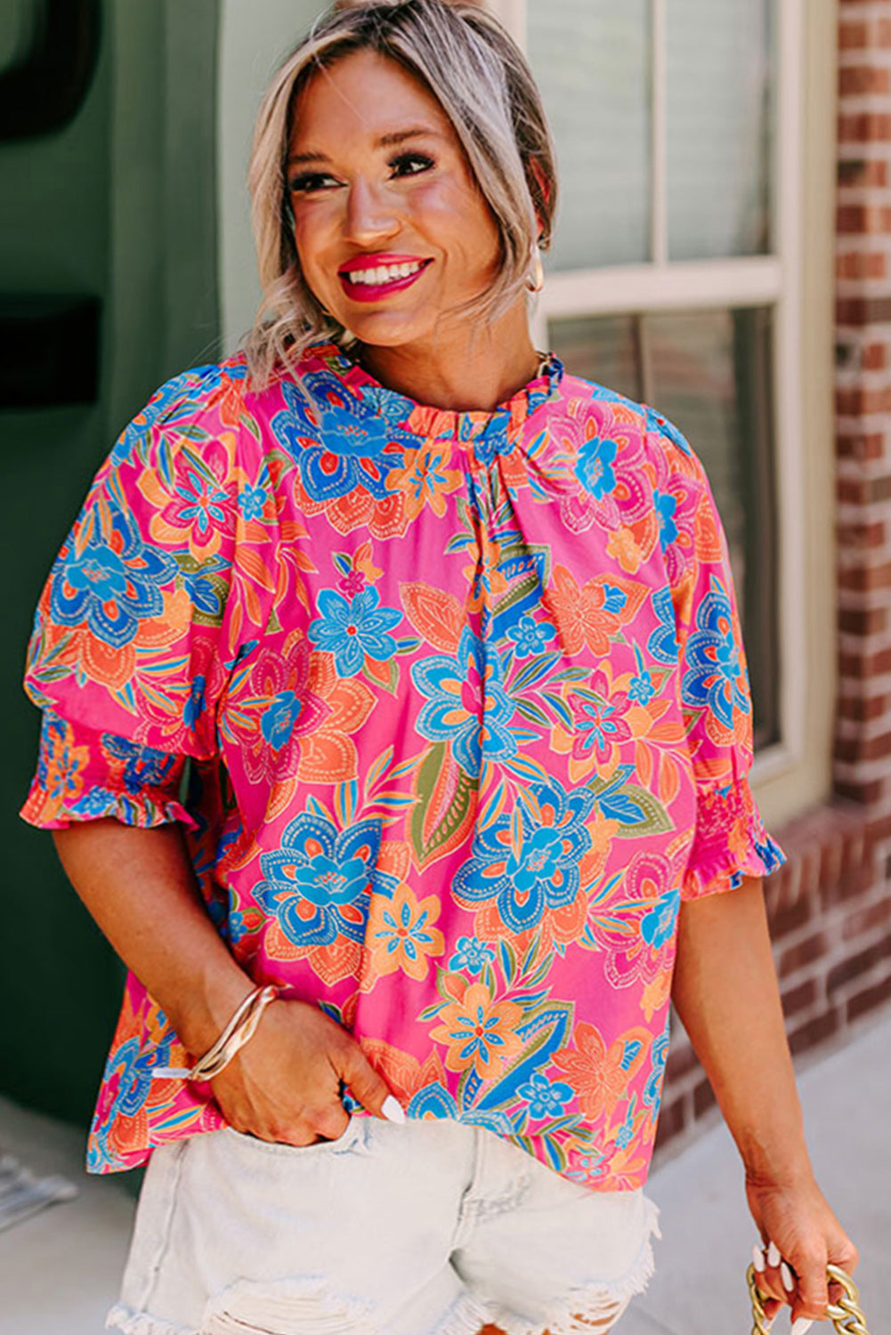 Chic floral print blouse with frilly neck and puff sleeves