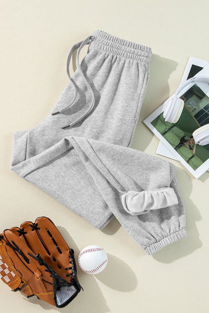 Cozy light grey fleece-lined joggers with adjustable drawstring waist