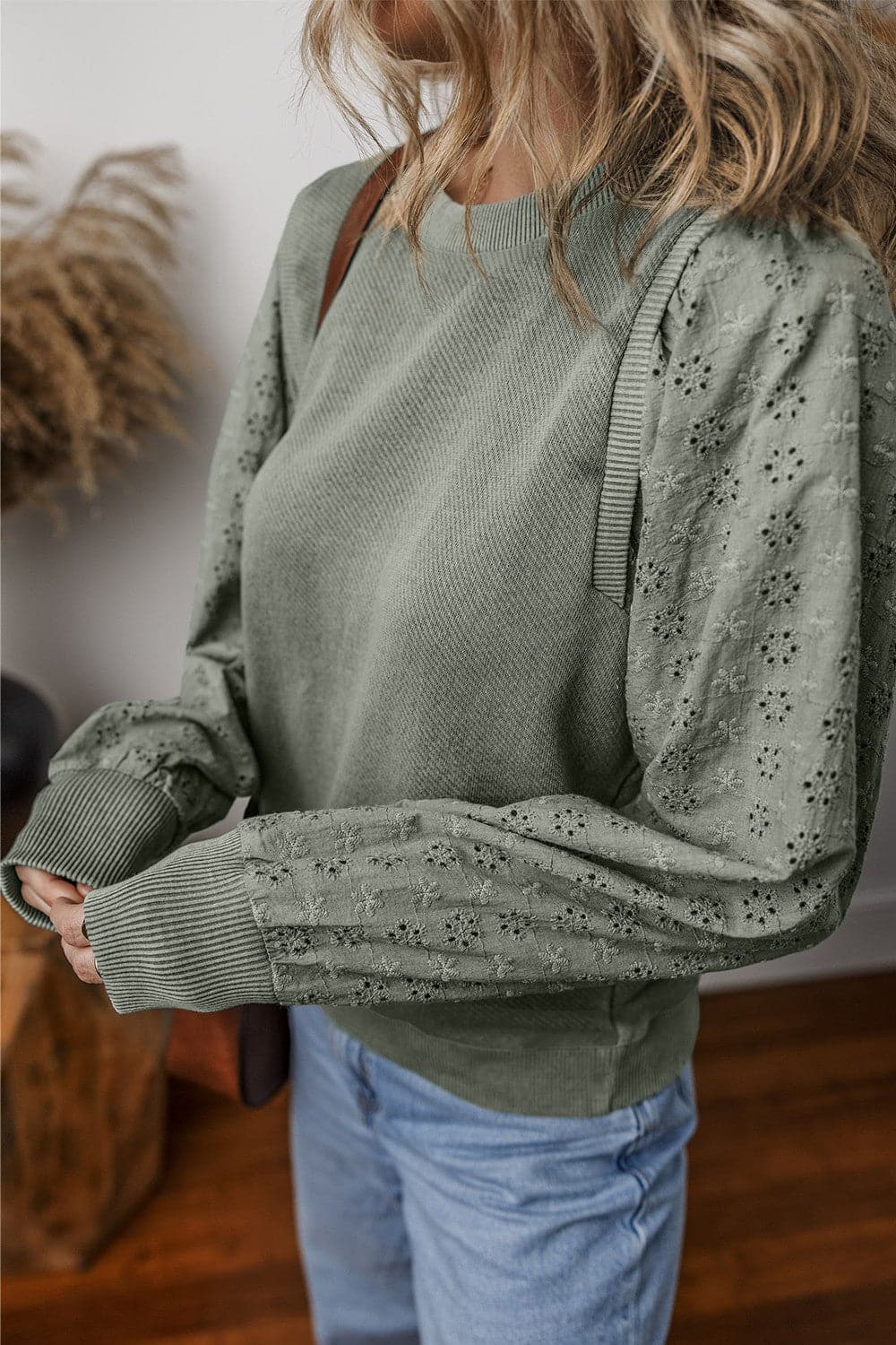 Eyelet Round Neck Long Sleeve Sweatshirt.