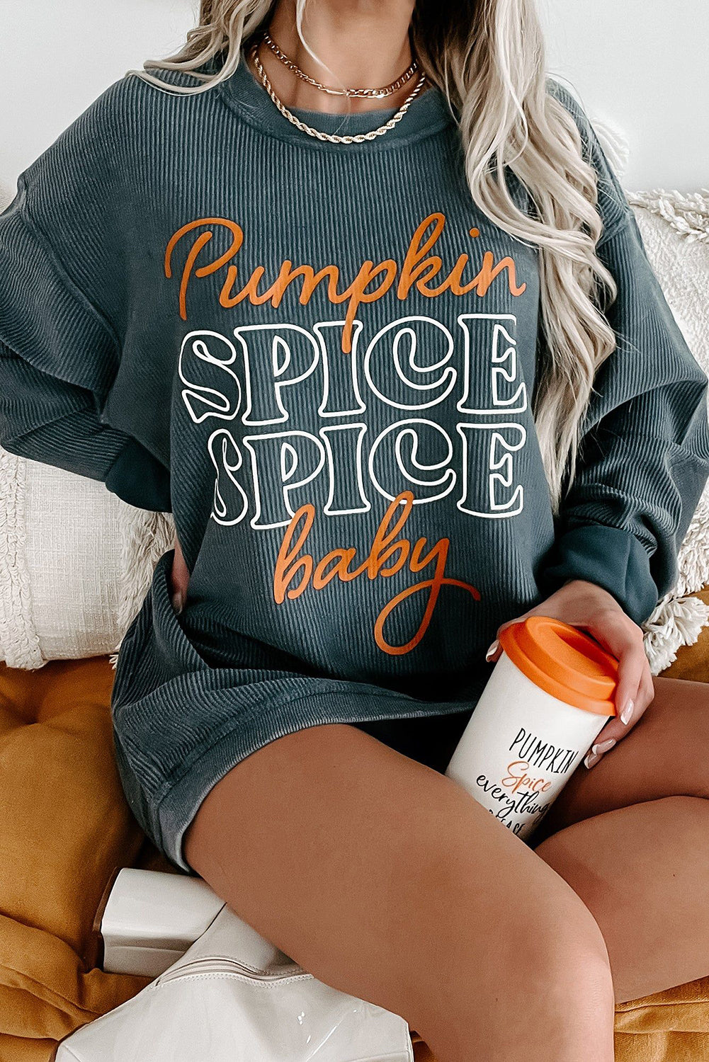 Dark grey Halloween pumpkin spice baby graphic textured sweatshirt with long sleeves.