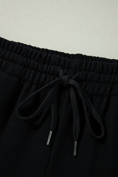 Cozy black fleece-lined casual pants with adjustable drawstring waist