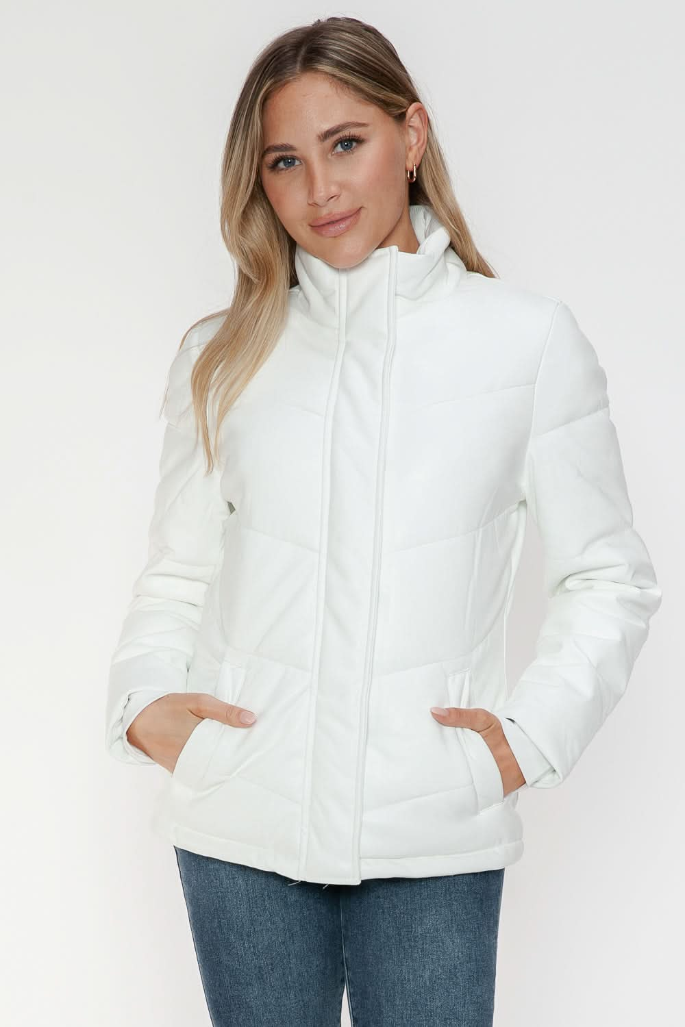 Snobbish Pocketed Zip Up Turtleneck Puffer Jacket in white worn by a model.