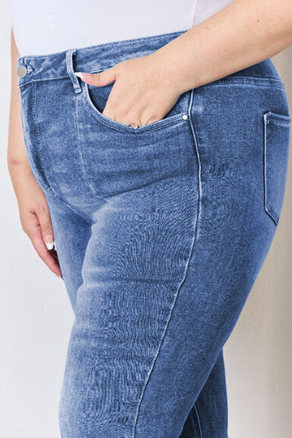 Stylish blue high-waist plus size flare jeans with exposed seam detail