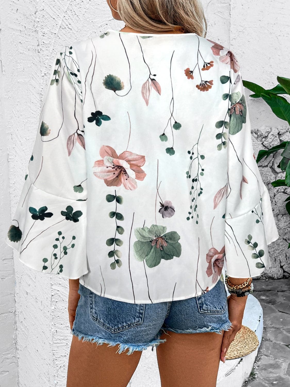 Ruffled Printed V-Neck Half Sleeve Blouse.